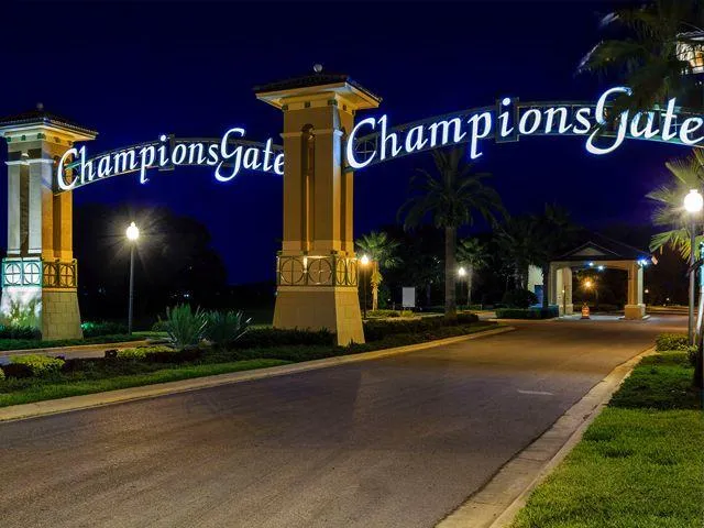 “Champions Gate vacation rental community entrance in Kissimmee, Florida near luxury Airbnb homes designed for higher occupancy and guest experience.”