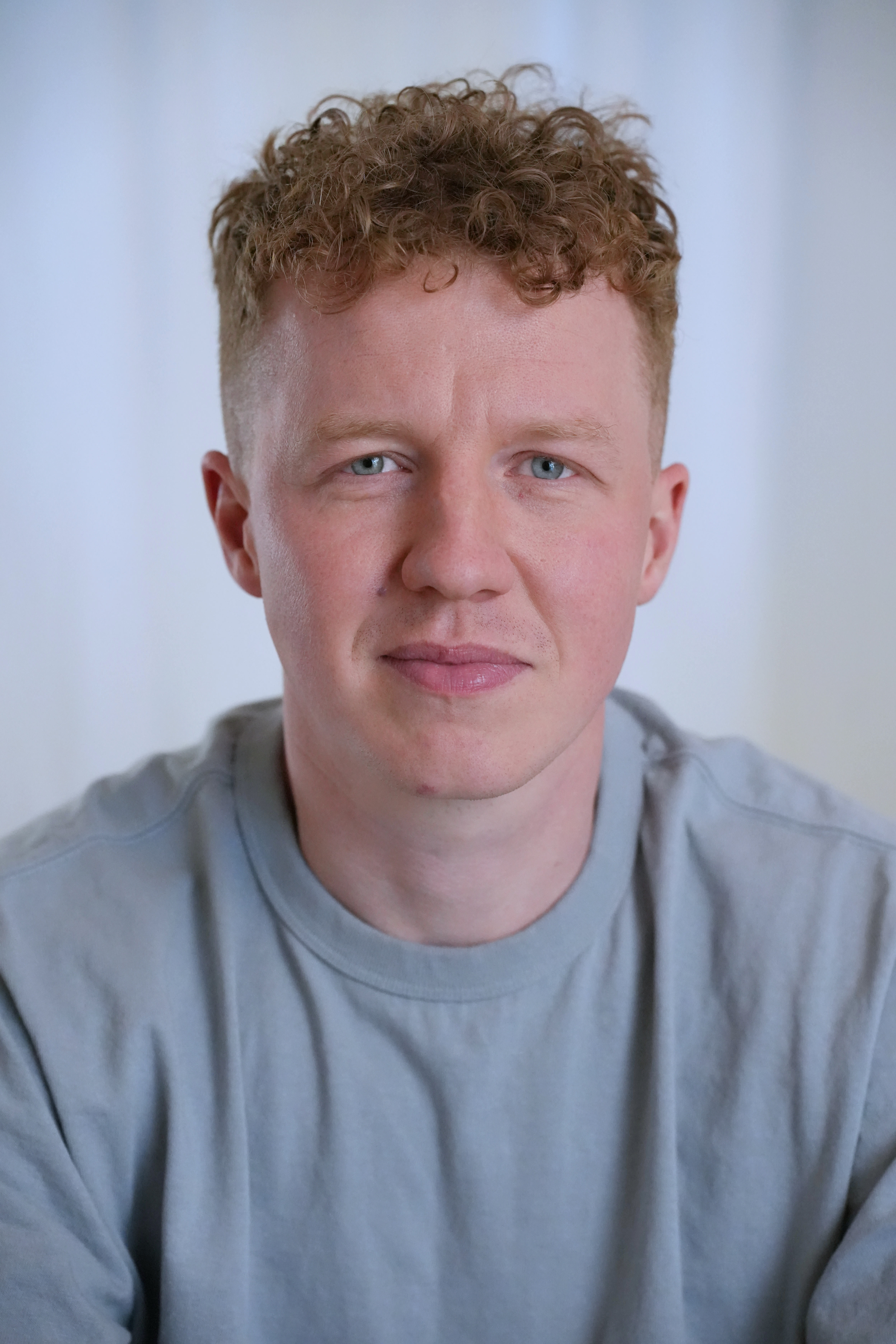 Freelancer smiling during a relaxed professional headshot session