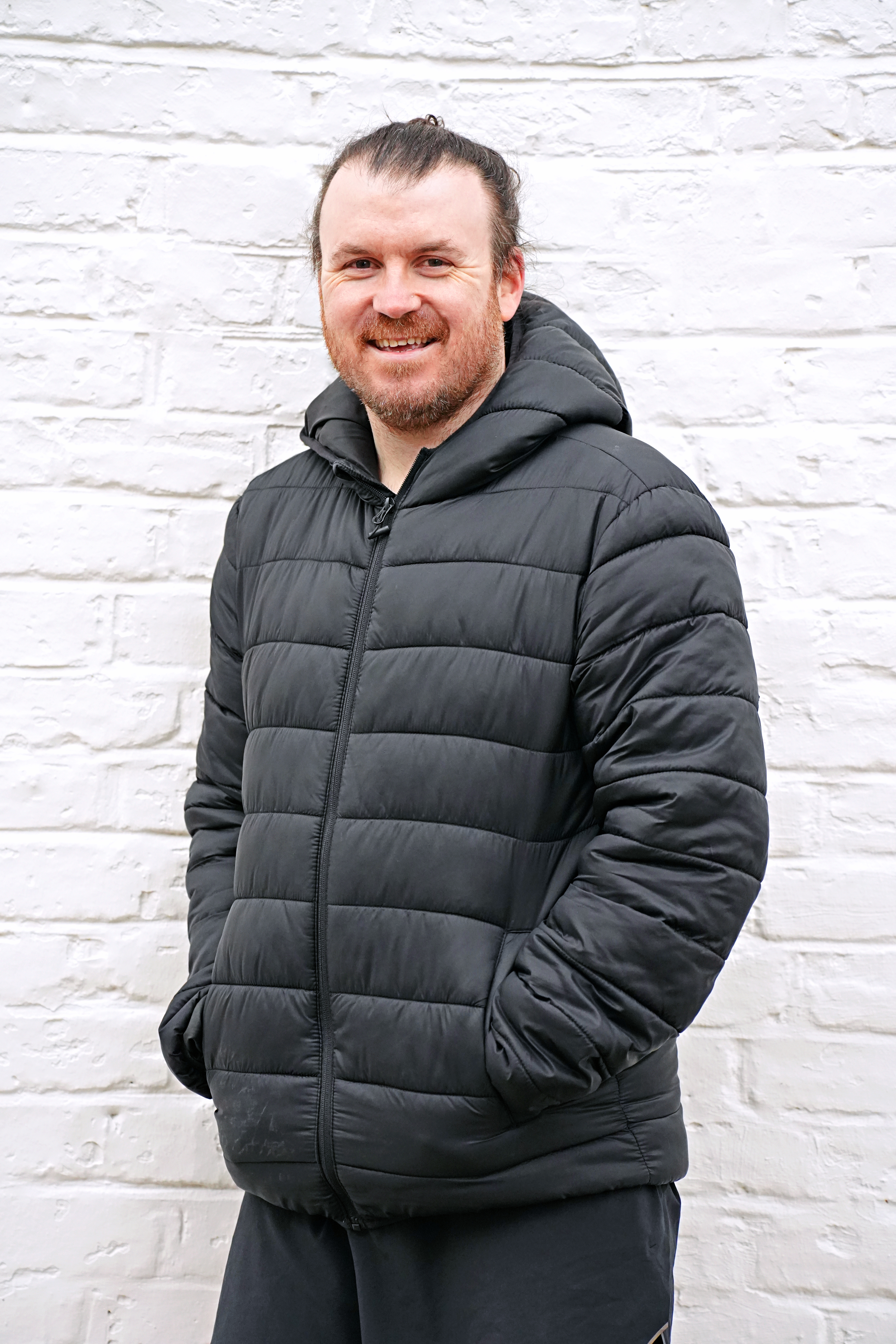 Freelancer smiling during a relaxed professional headshot session