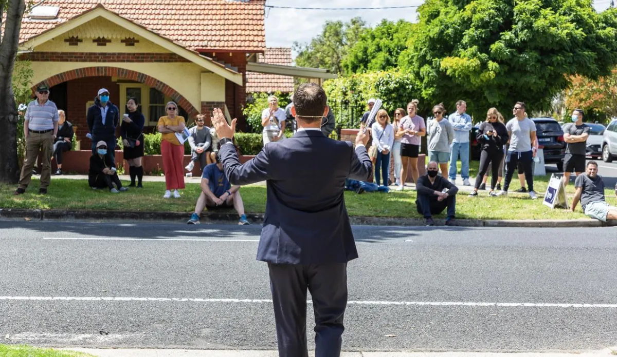 man addressing crowd