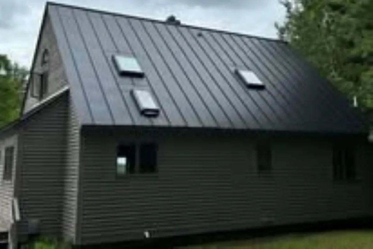 Durable metal roofing on a commercial or residential building in Western NH, expertly crafted by Olsen’s Roofing.