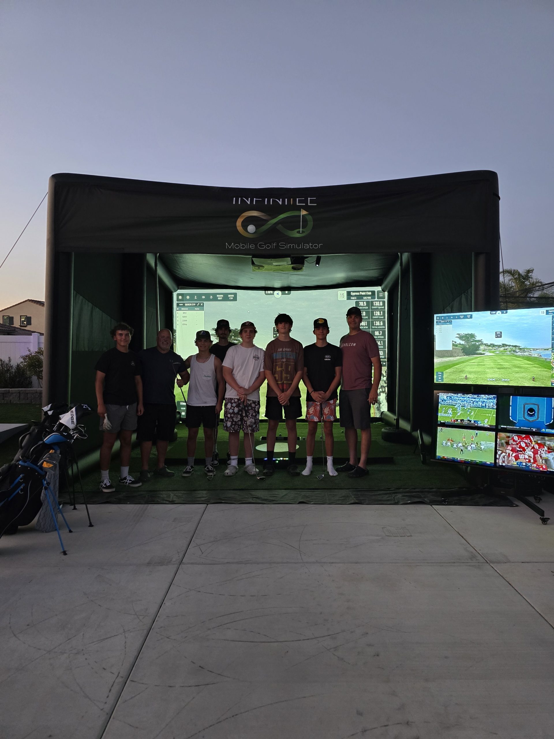 A pair of golf clubs sitting on top of a green field