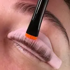 Close-up of a professional lash lift treatment with curling solution applied to natural eyelashes at Soul Serenity