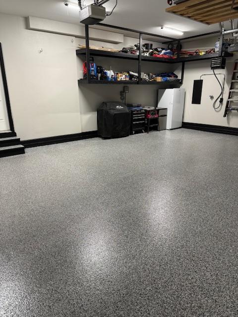 Semi-coverage random flake epoxy garage floor with textured finish and protective topcoat