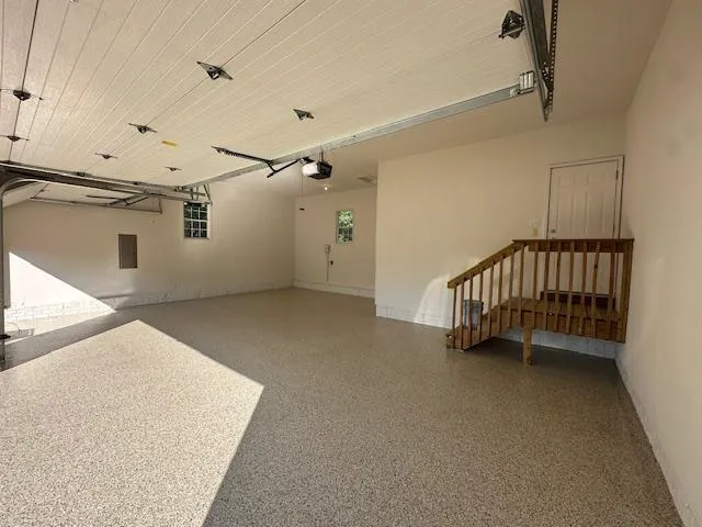 Finished epoxy flooring in a Des Moines garage built to withstand Iowa’s seasonal weather conditions