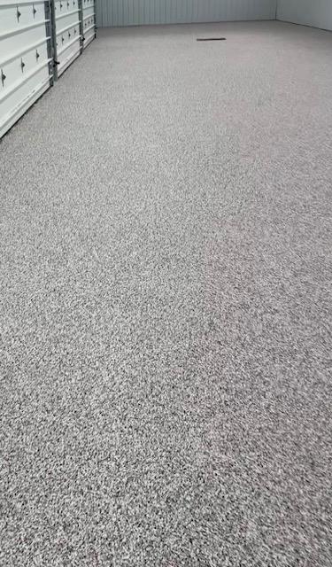 Professional Iowa epoxy flooring installation with properly prepared concrete surface