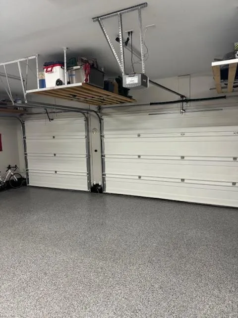 A high-durability epoxy garage floor built to defend concrete against hidden threats like moisture intrusion, road salt pitting, and chemical stains.