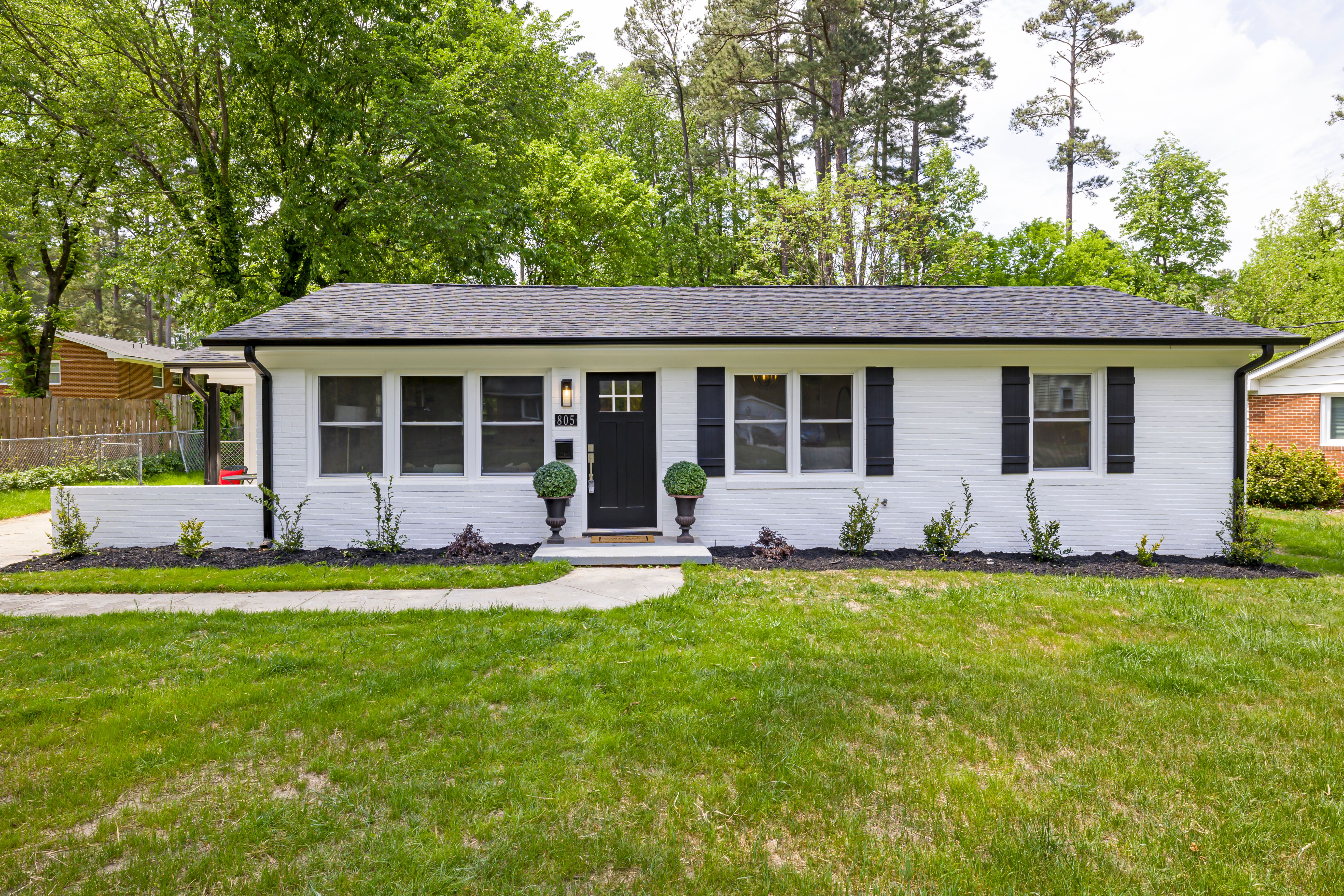 Mid century Cape Cod homes on a tree shaded street in the Suburban Acres neighborhood of Norfolk, Virginia