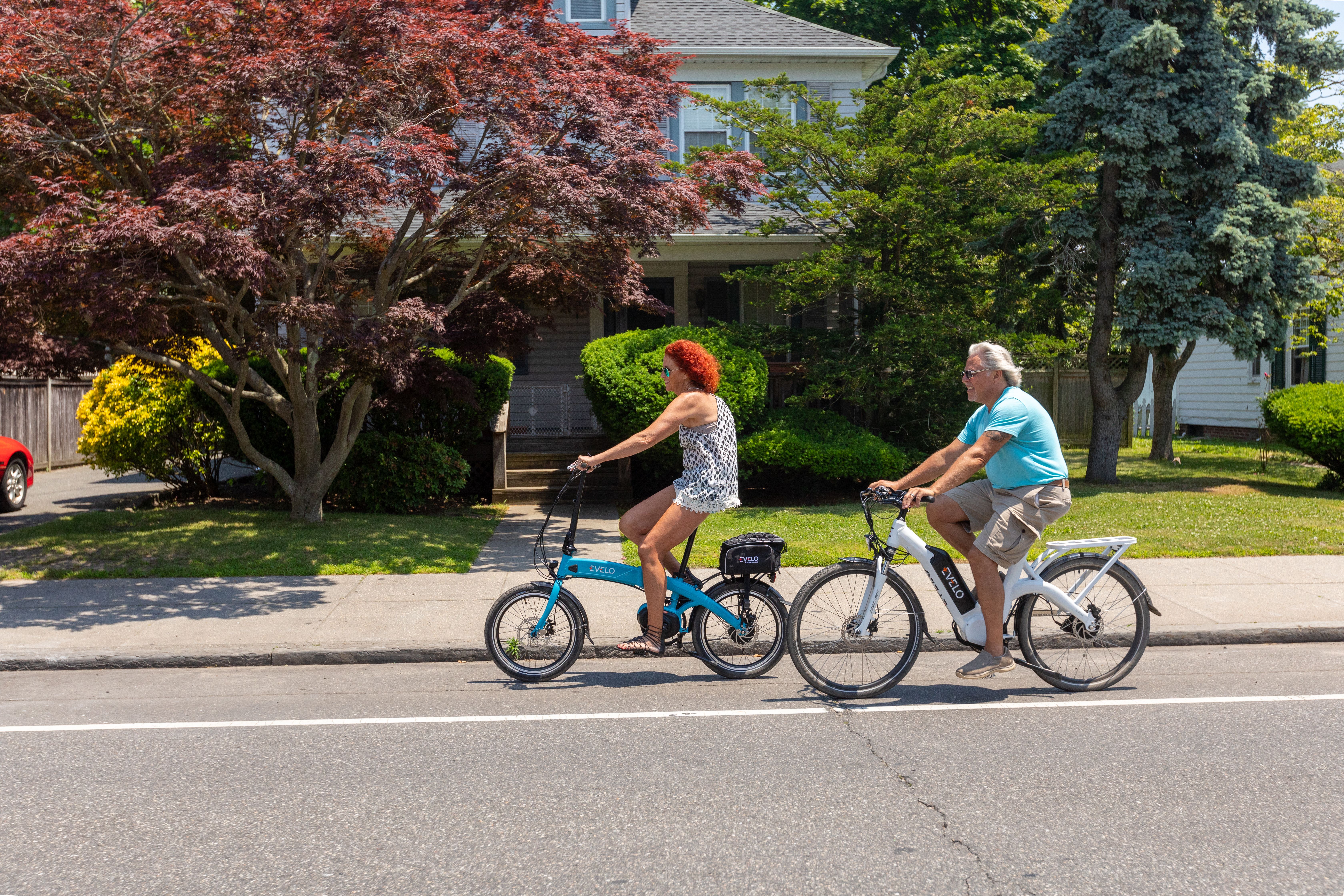 Cyclist riding to a waterfront restaurant in a walkable Virginia Beach coastal neighborhood