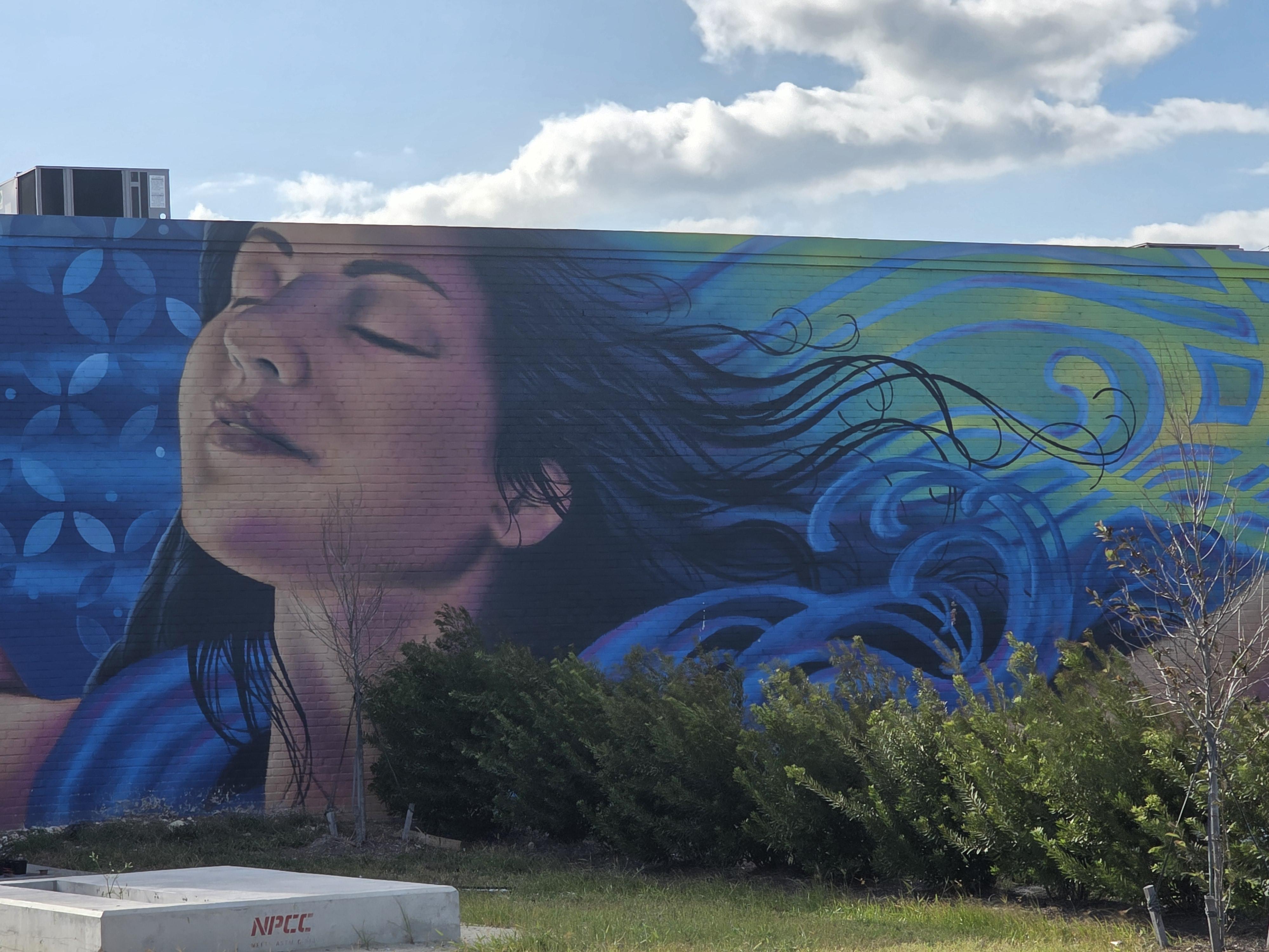 Mural lined street in the ViBe Creative District near the Virginia Beach Oceanfront with local shops