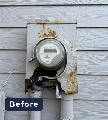 Before: corroded electrical meter base on a home exterior