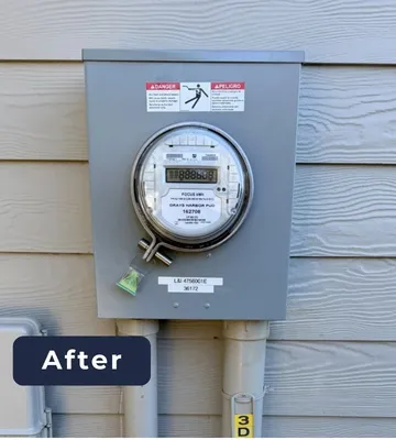 After: newly installed electrical meter base and service equipment