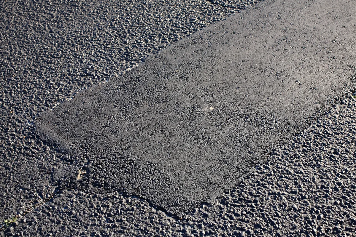 Black Hawk Paving asphalt patchwork repair, restoring damaged pavement for a smooth, durable surface.