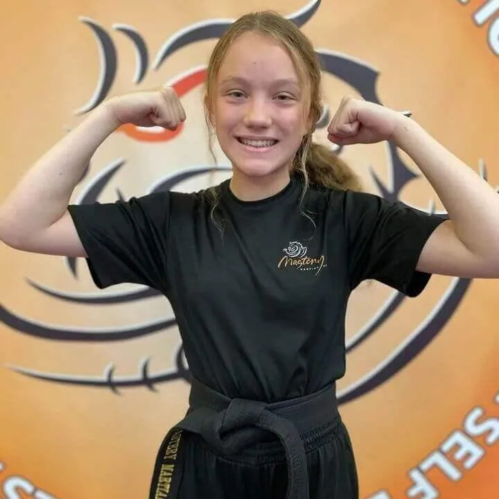 kids martial arts troy - girl muscle pose