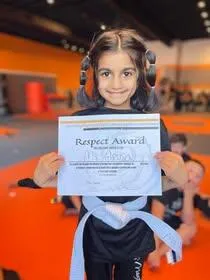 kids martial arts troy - girl with certificate