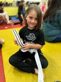 kids martial arts troy -girl sitting with smile