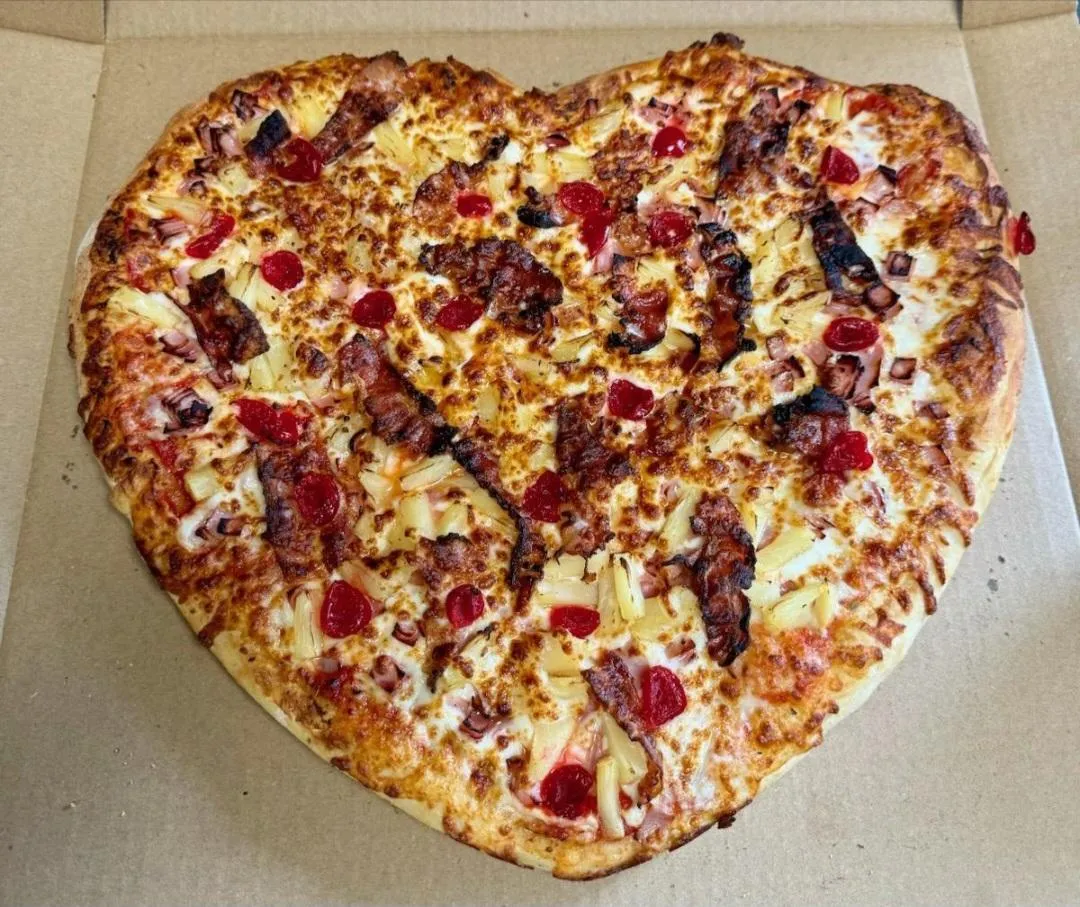person holding white and brown pizza