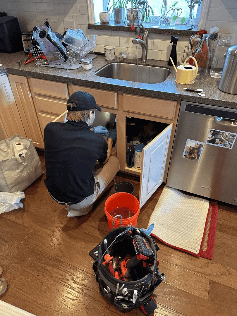 white top mount refrigerator beside white wooden kitchen cabinet