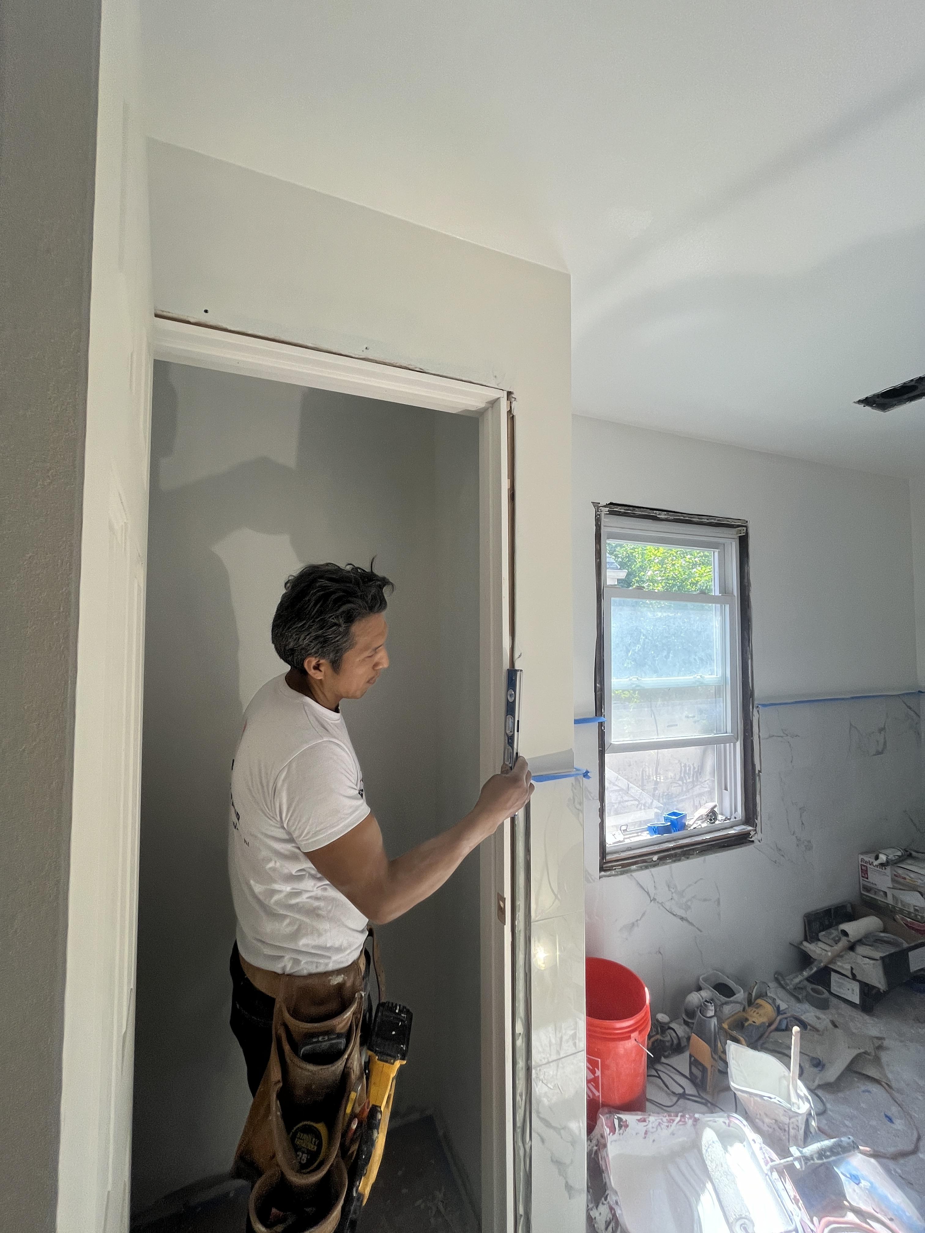 assorted hand tools on brown wooden table