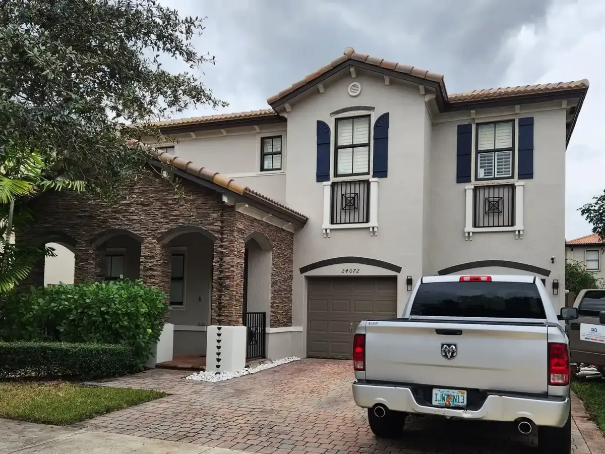 Completed impact window installation in Kendall FL featuring sleek windows and a well-maintained modern home facade.