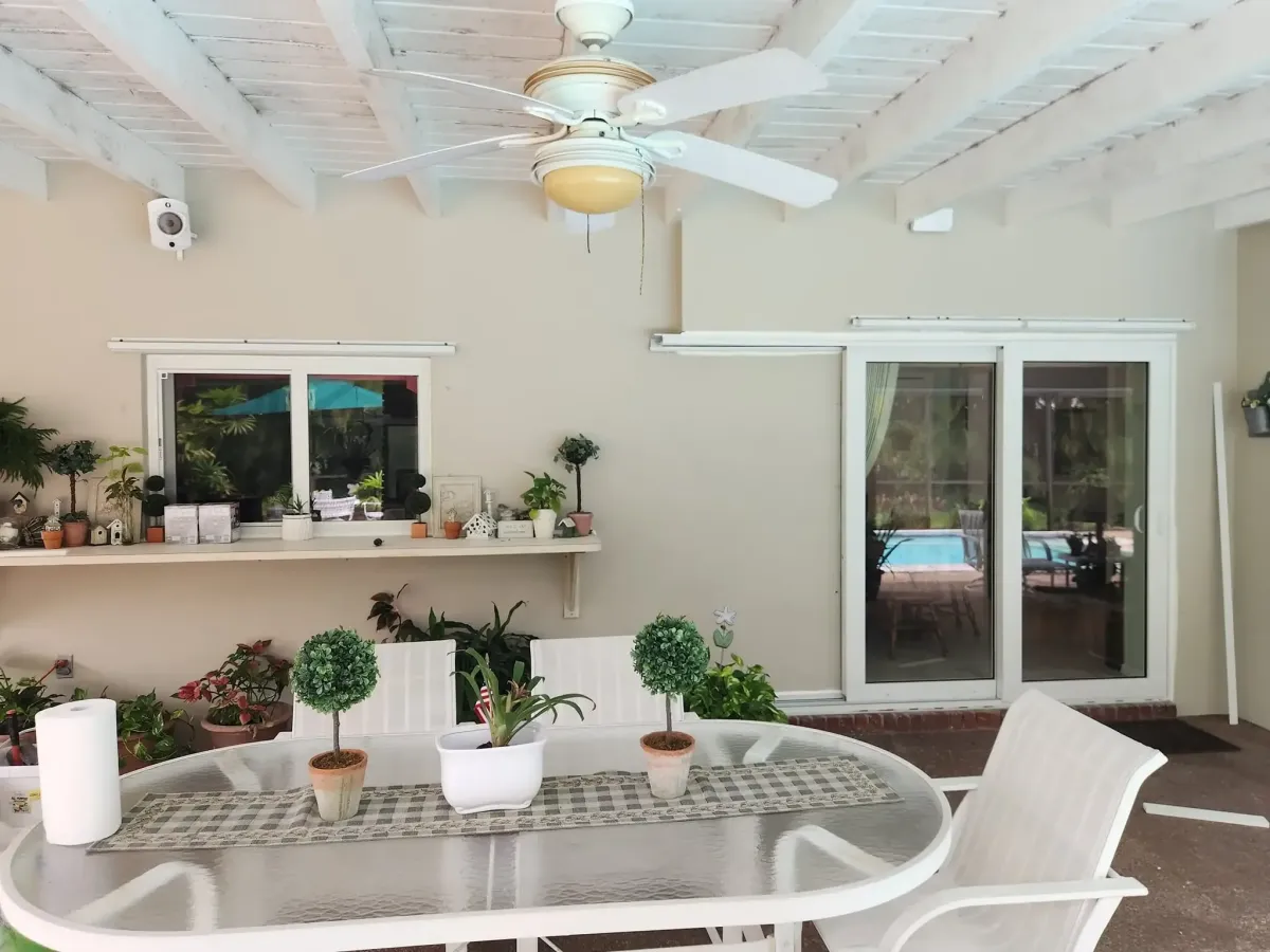 Freshly installed impact window in a modern Kendall home, showcasing sleek design and vibrant landscaping.