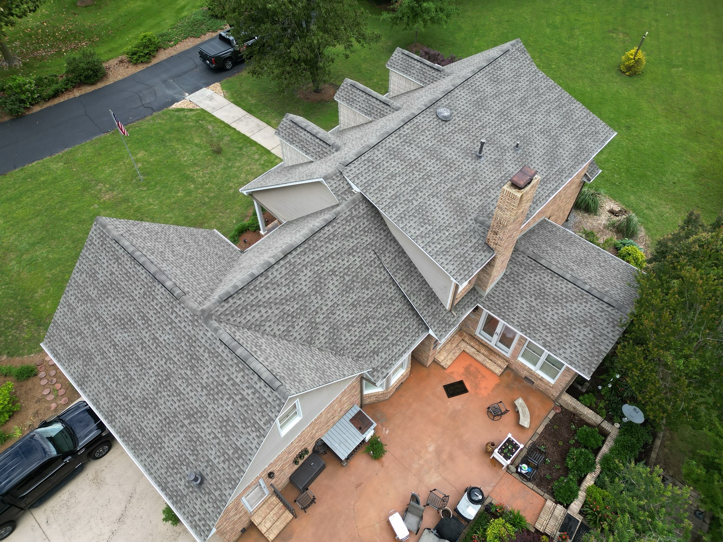 The roof of a building with a tree in the background