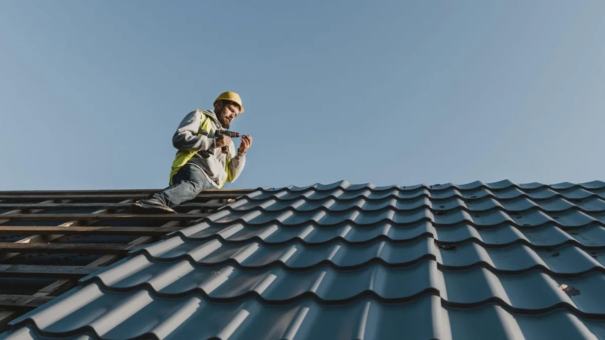 an expert roofer on tile roofing installation