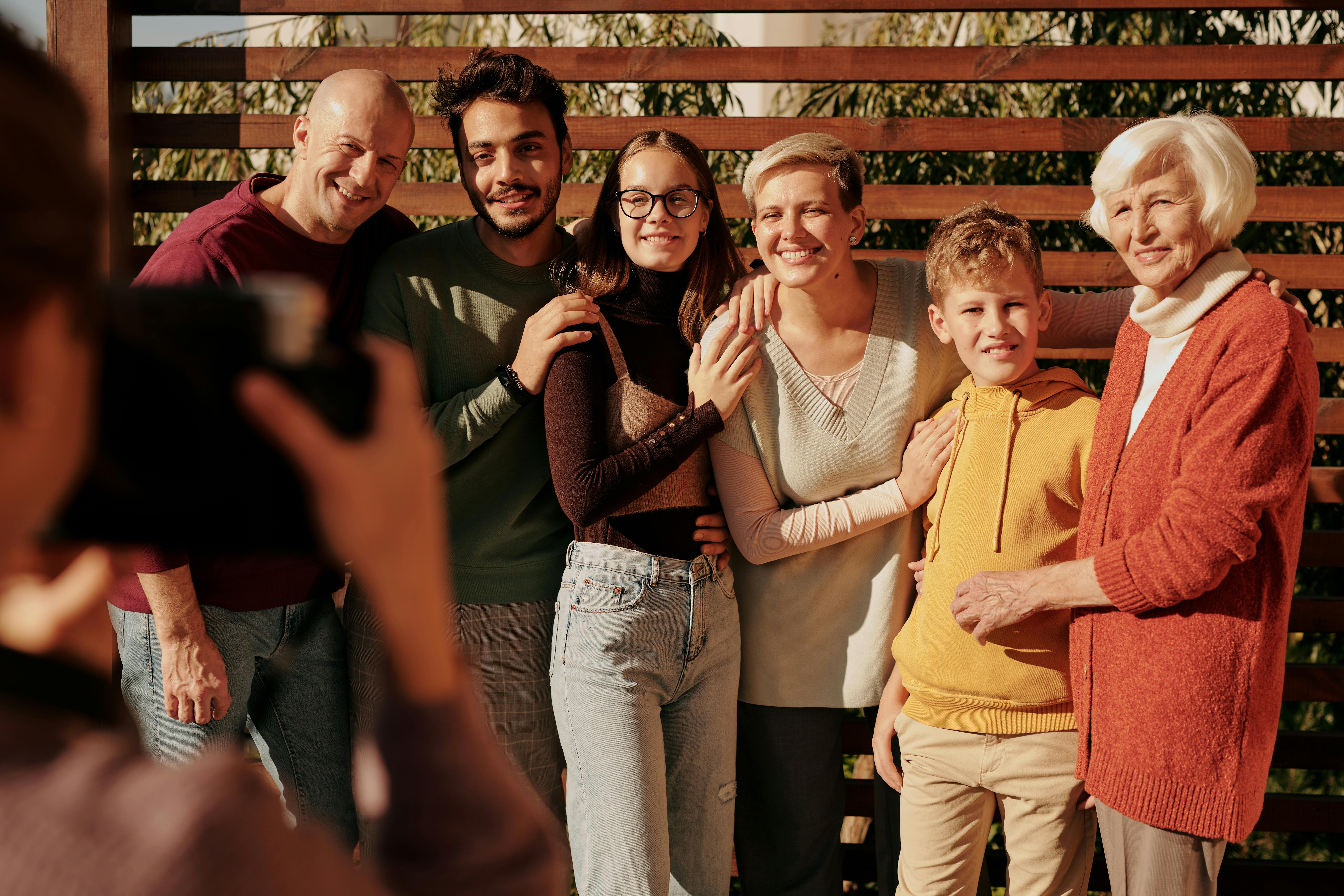Latin American multigenerational family at home with multiple adults and an elderly parent