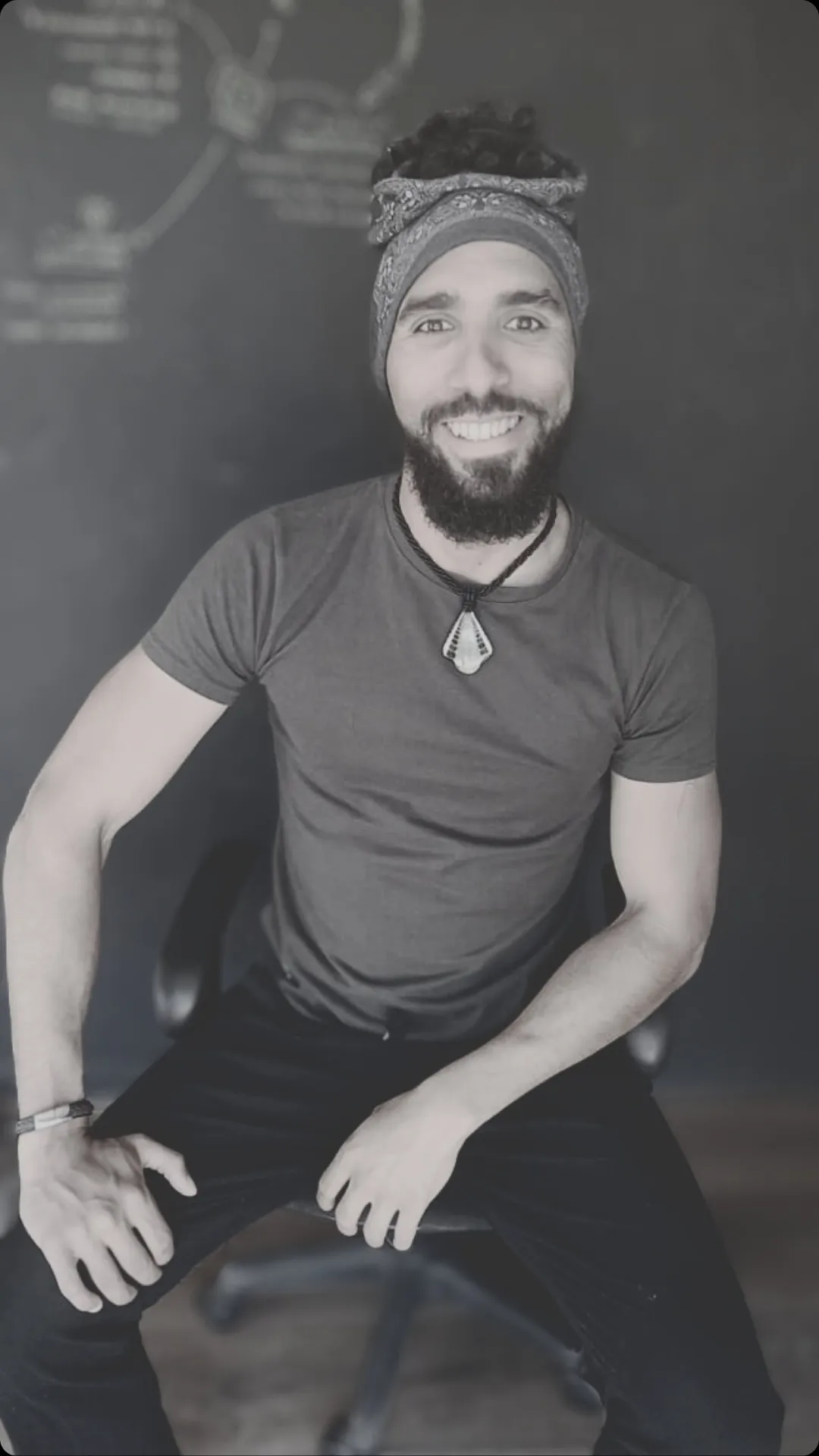 woman in black sweater holding white and black vr goggles