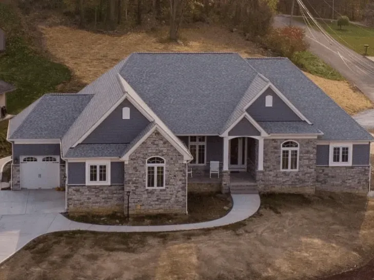 Professionally remodeled kitchen in Canonsburg PA with modern cabinetry, quartz island, high-end appliances, and natural lighting.