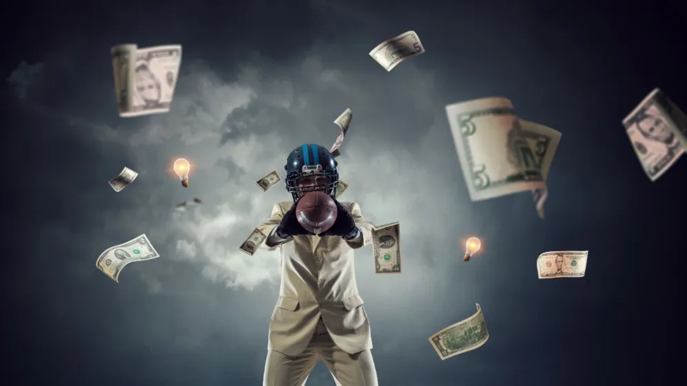 Thriving in the Fire: The Complex World of High-Profile Collegiate Athletes in the Era of NIL and Sports Betting – Is it Too Much?