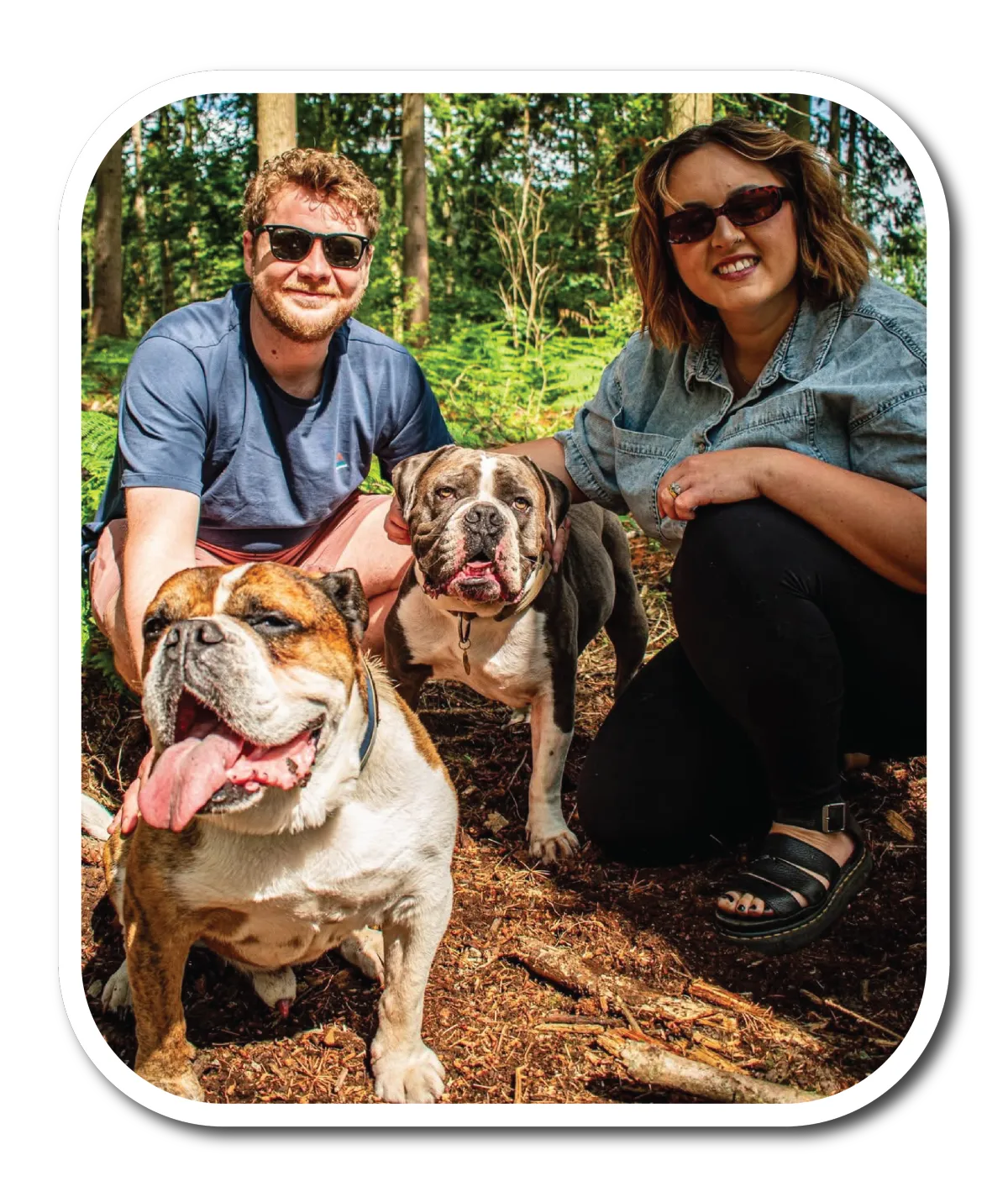 picture of man, woman and two bulldogs