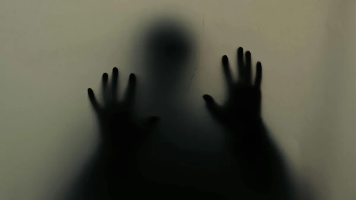 Anxious person experiencing fear and worry.