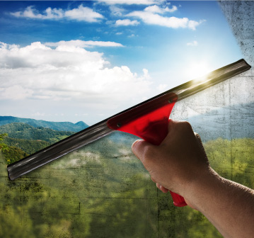 Man cleaning car dashboard with brush