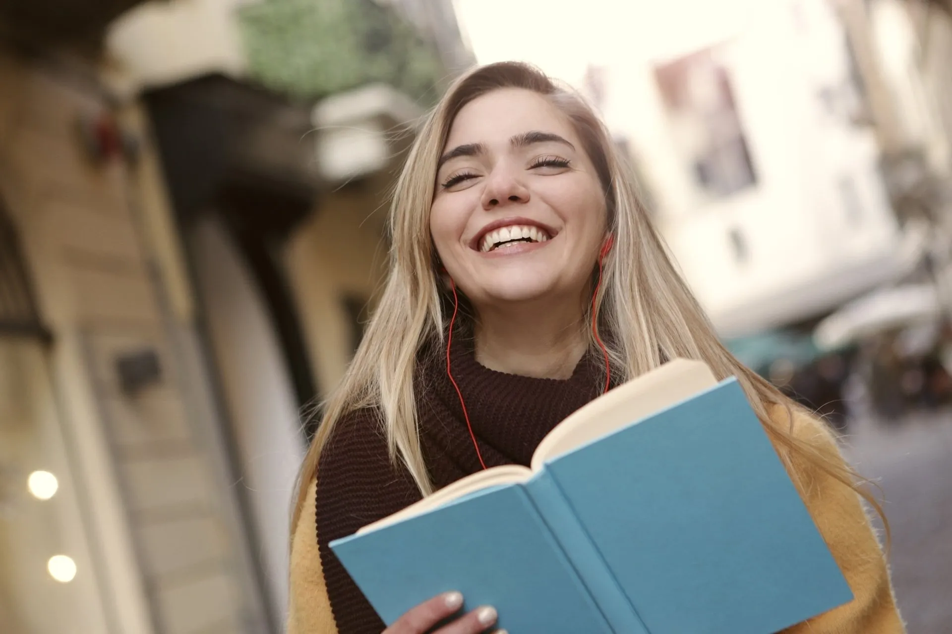 Girl smiling with a book