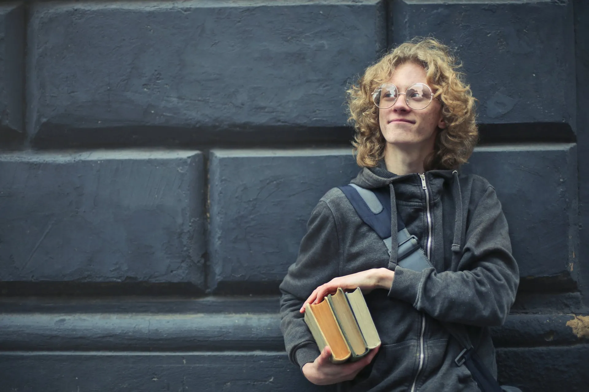 Male student holding books