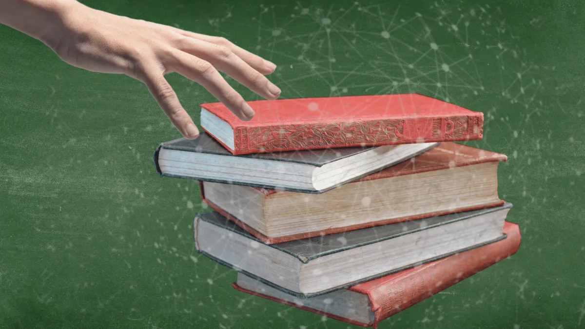 Person reaching to read a book