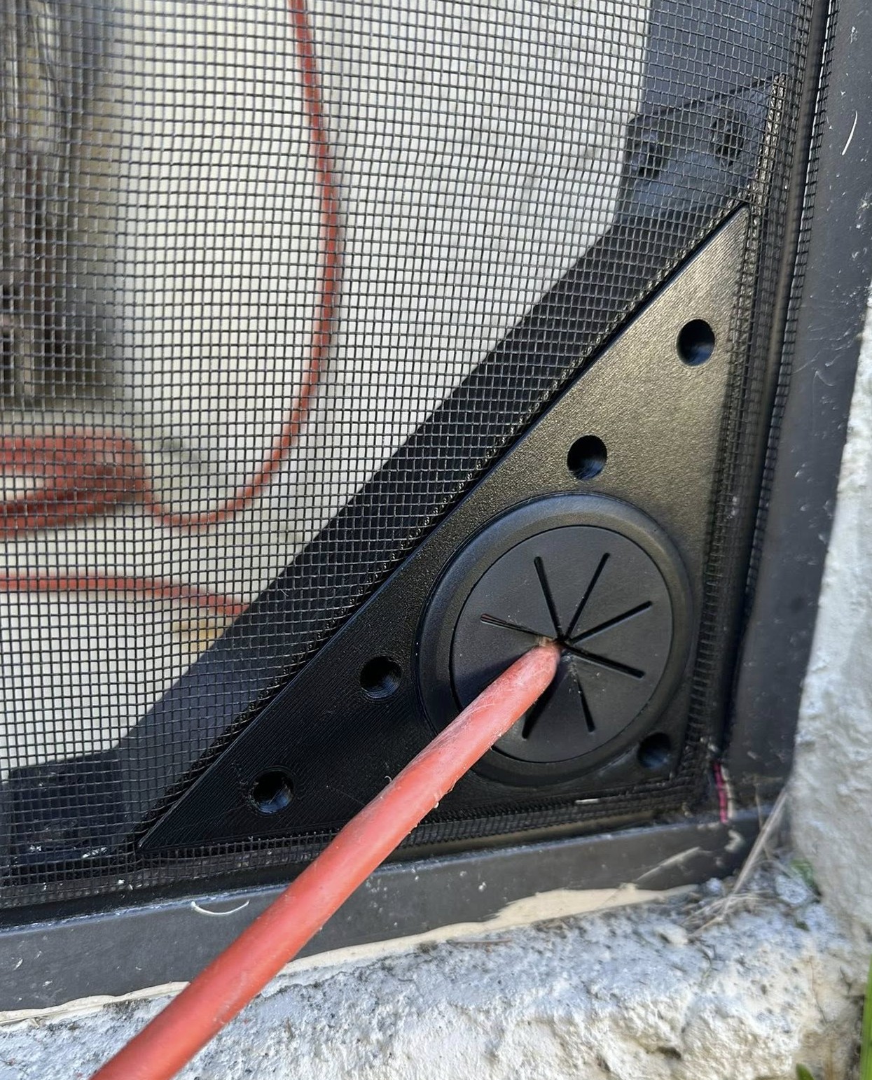 PatioPass smart cord pass-through installed on a screen enclosure