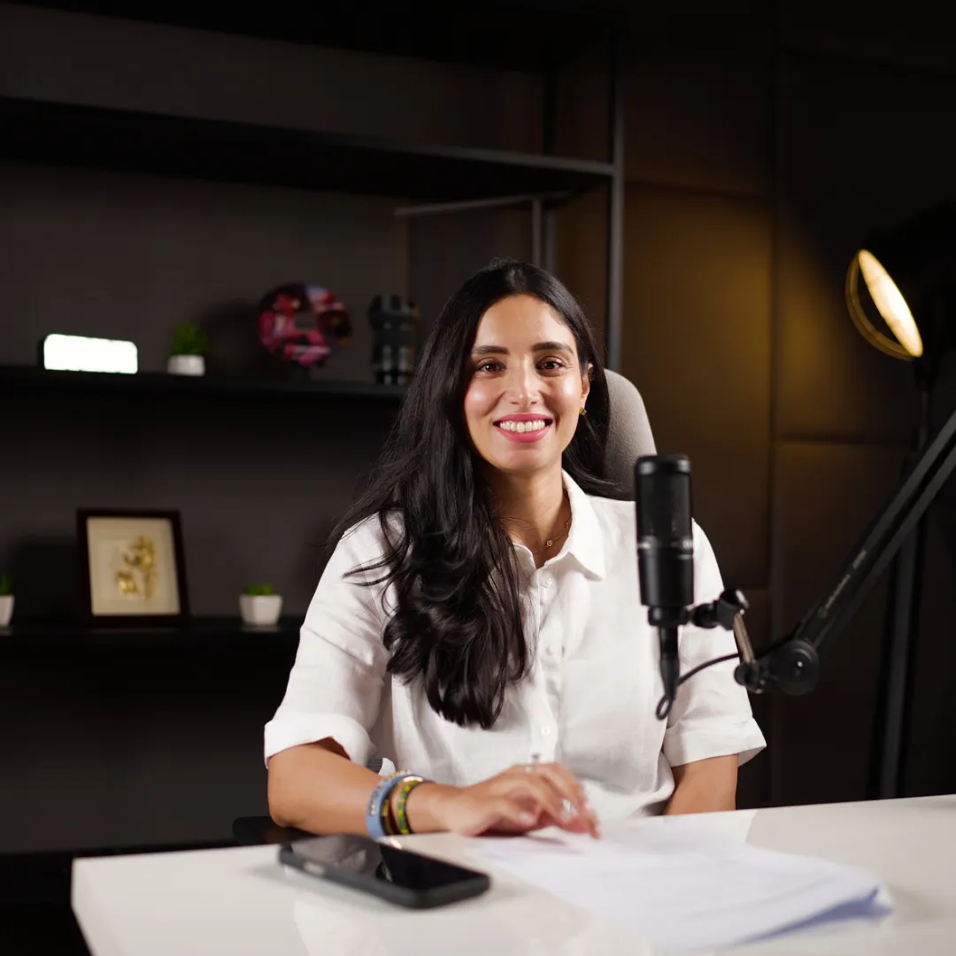 Female podcaster recording in professional home studio setup