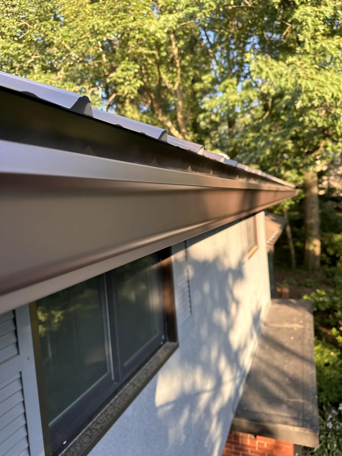 New bronze colored rain gutter system installed on Stroudsburg, PA property by Gutter Solutions of NEPA