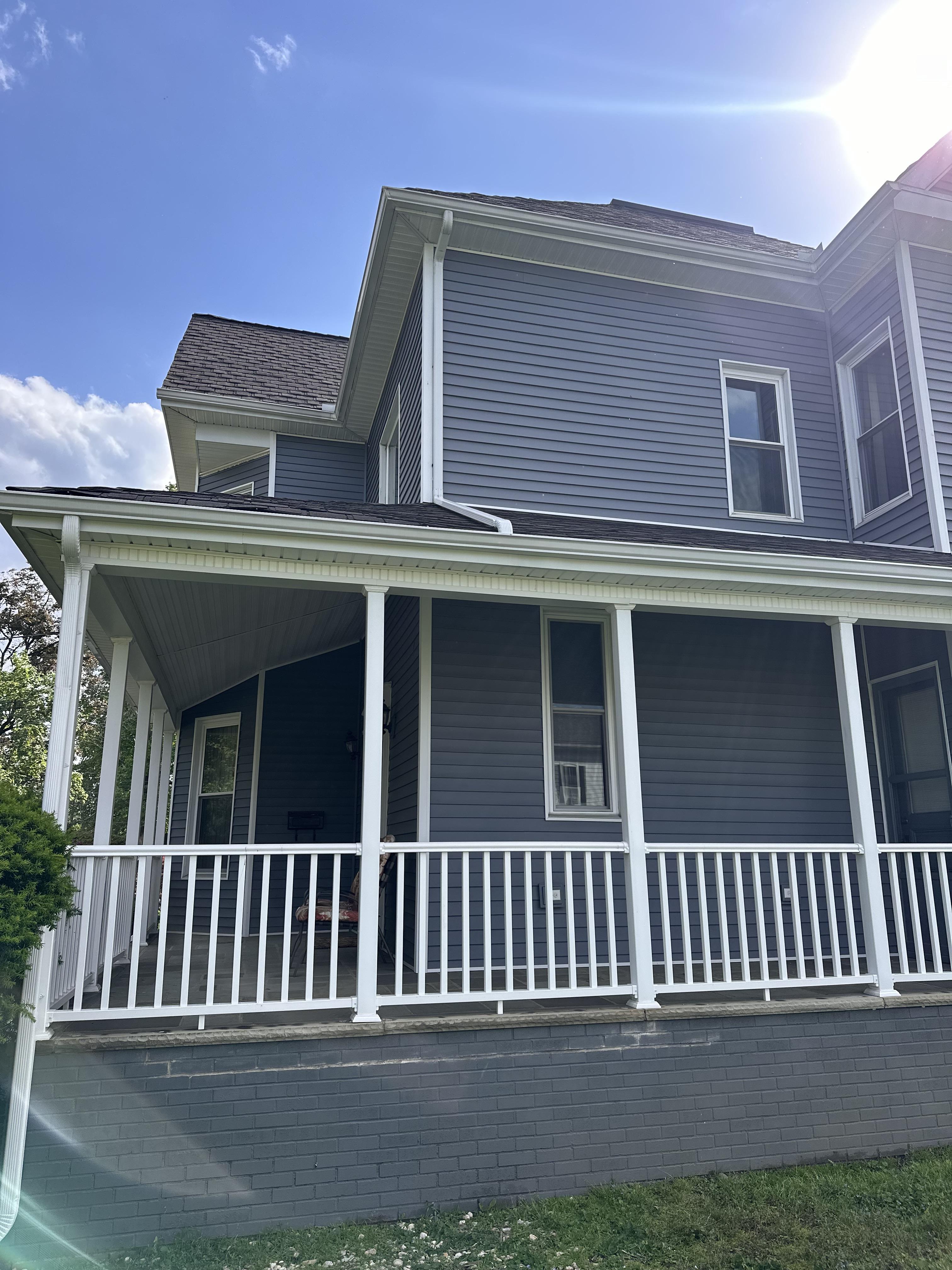 Sunny brand new gutters on blue PA home