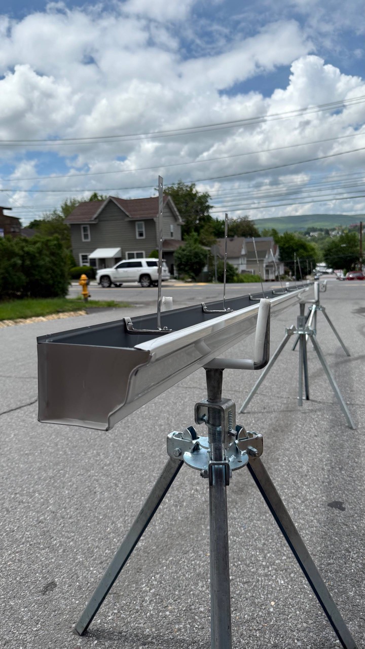 New custom seamless aluminum gutter system being fabricated and measured out prior to installation