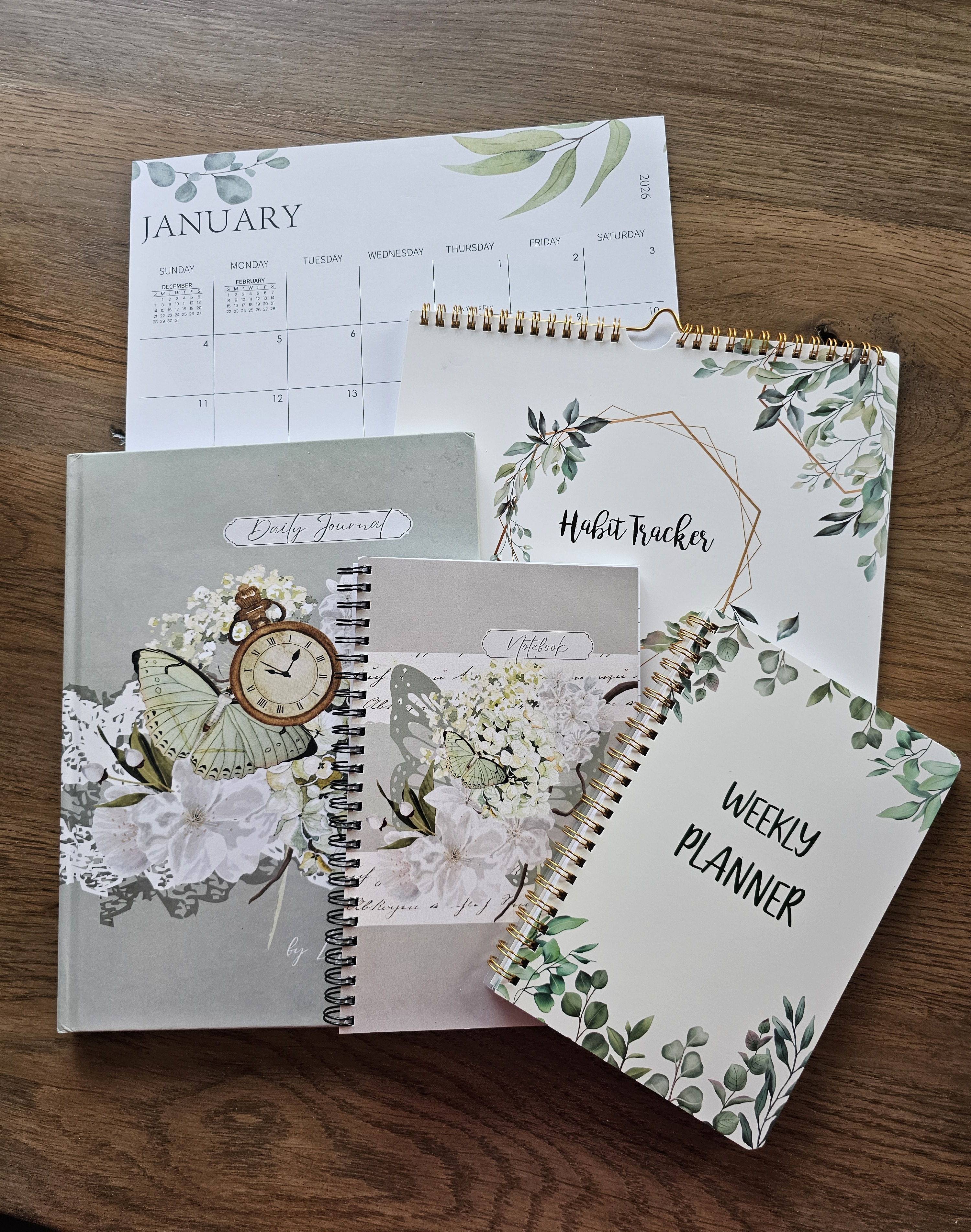 A close-up of a woman's hands holding a beautifully designed event ticket and a delicate pink flower, set on a rustic wooden table with soft natural light. The scene feels hopeful and celebratory.