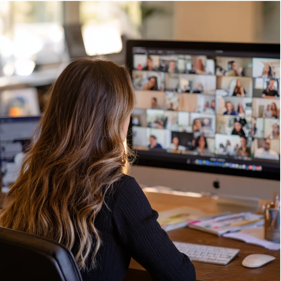 men and women sitting on chairs inside room