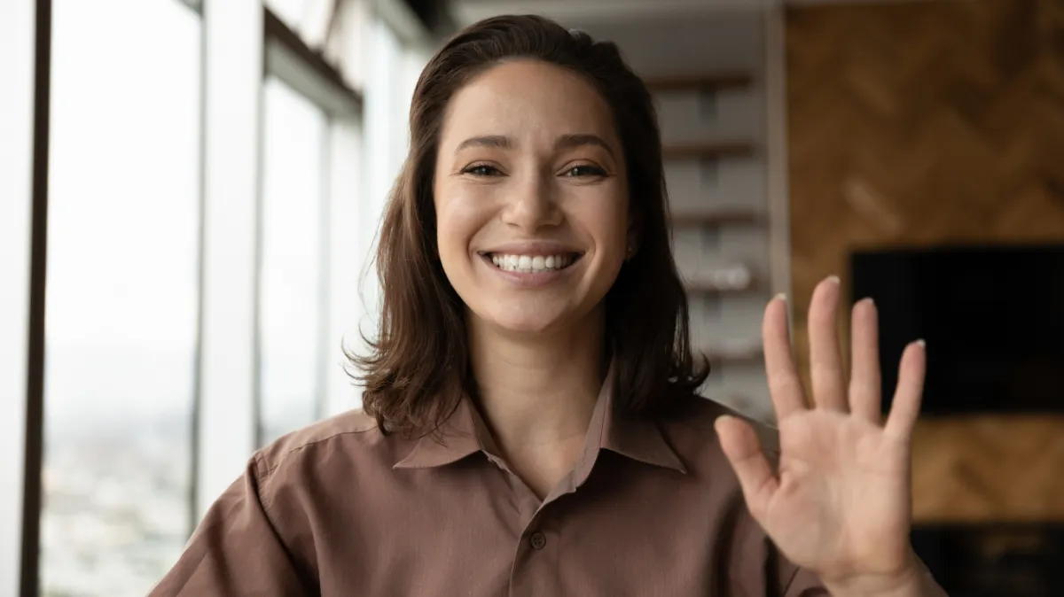 shallow focus photography of person holding camera lens