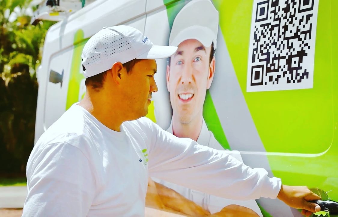 Artist paints on canvas in a light-filled studio.