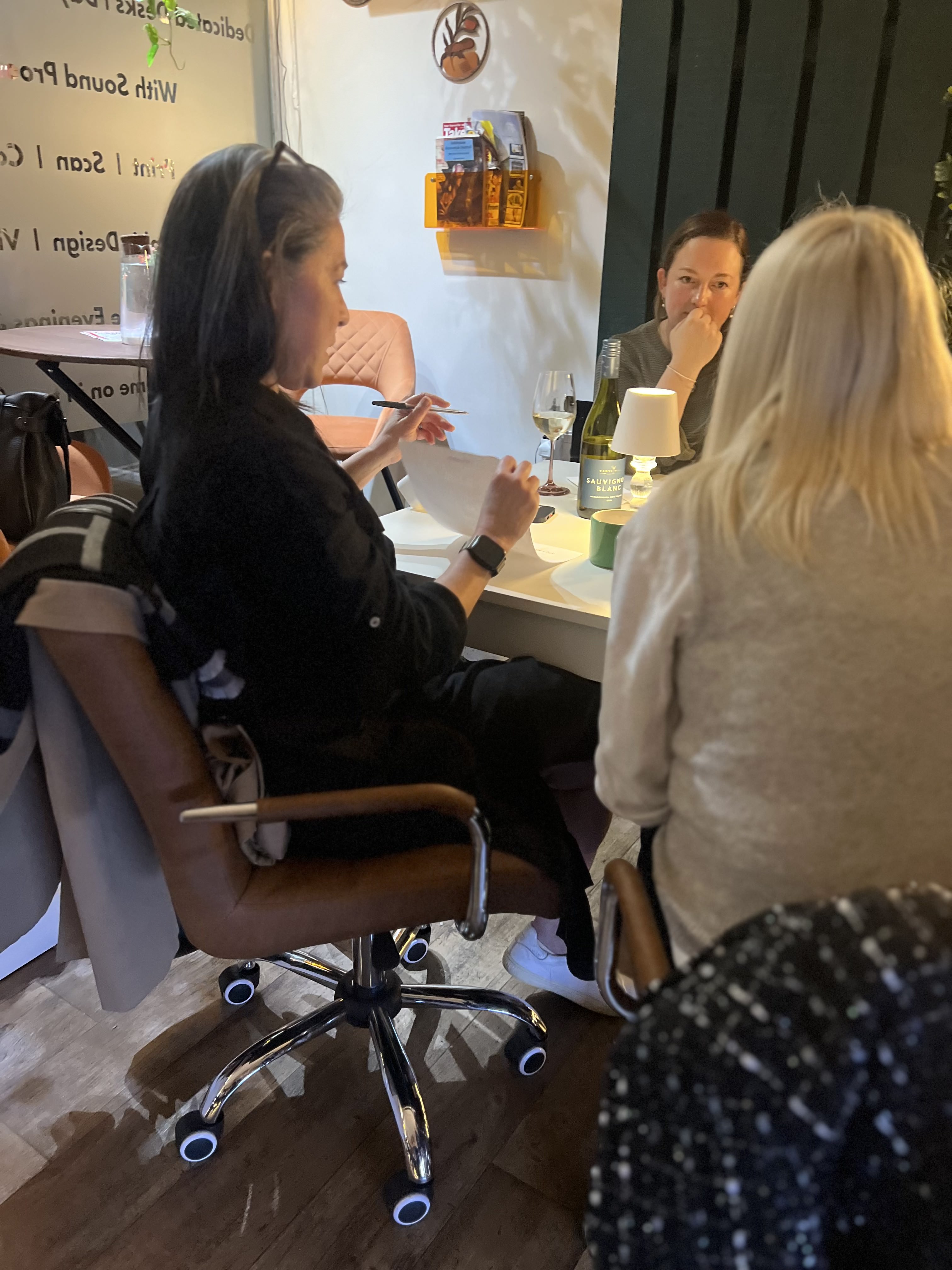 Women talking at Whisper and Wine Book Club