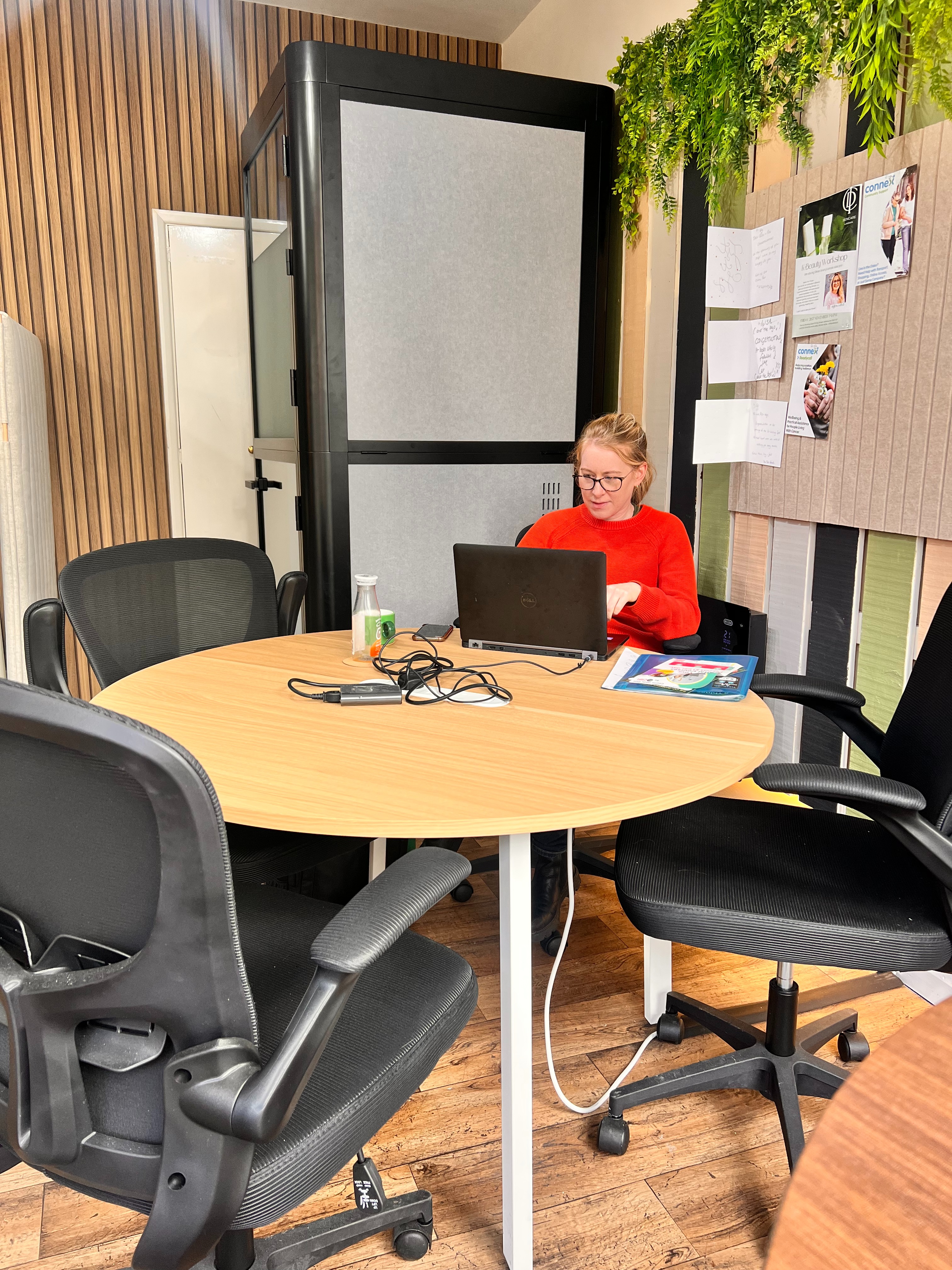 Image of a woman working on a laptop