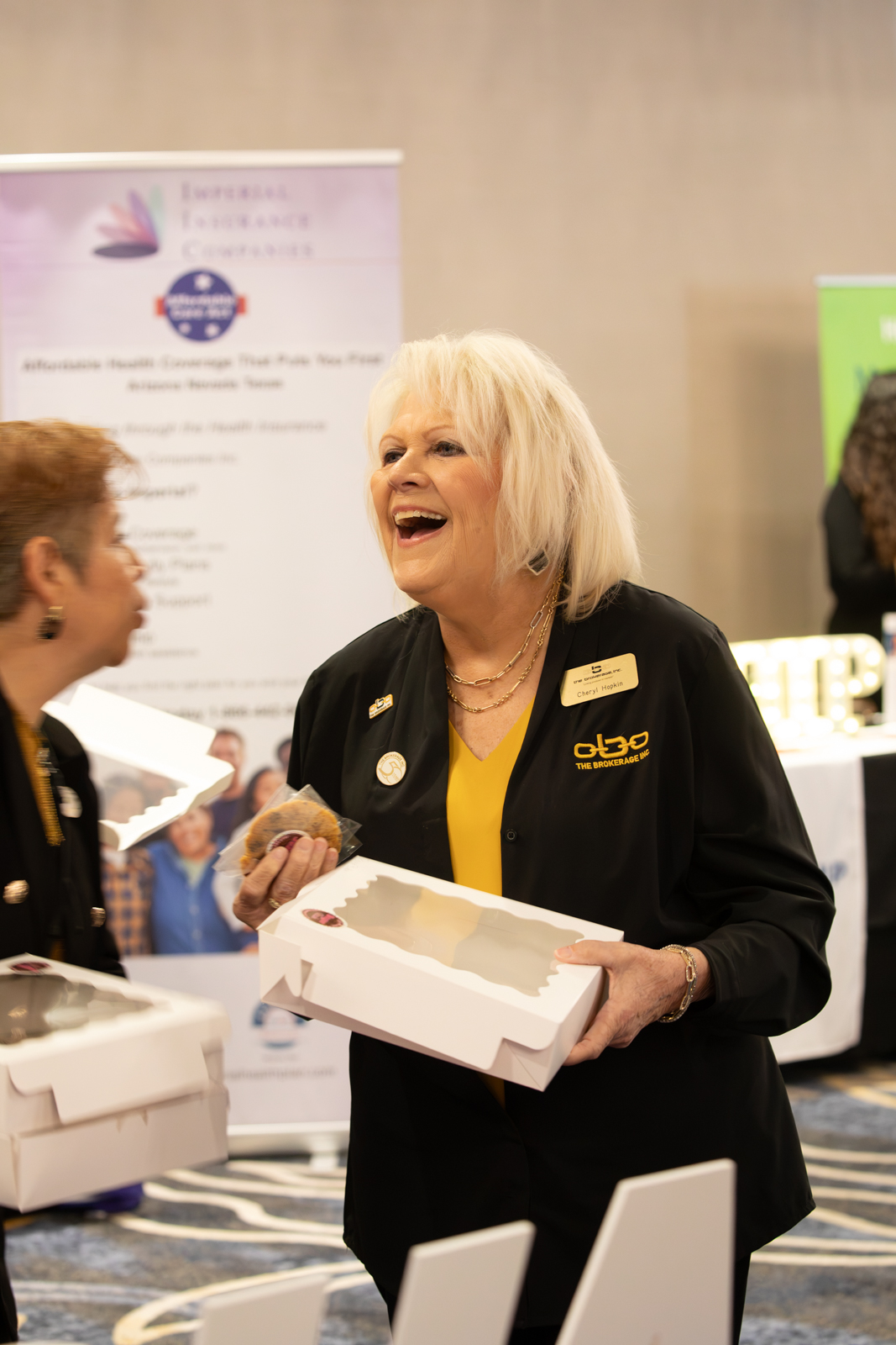 Attendees engaged in lively discussion and networking in the hospitality lounge
