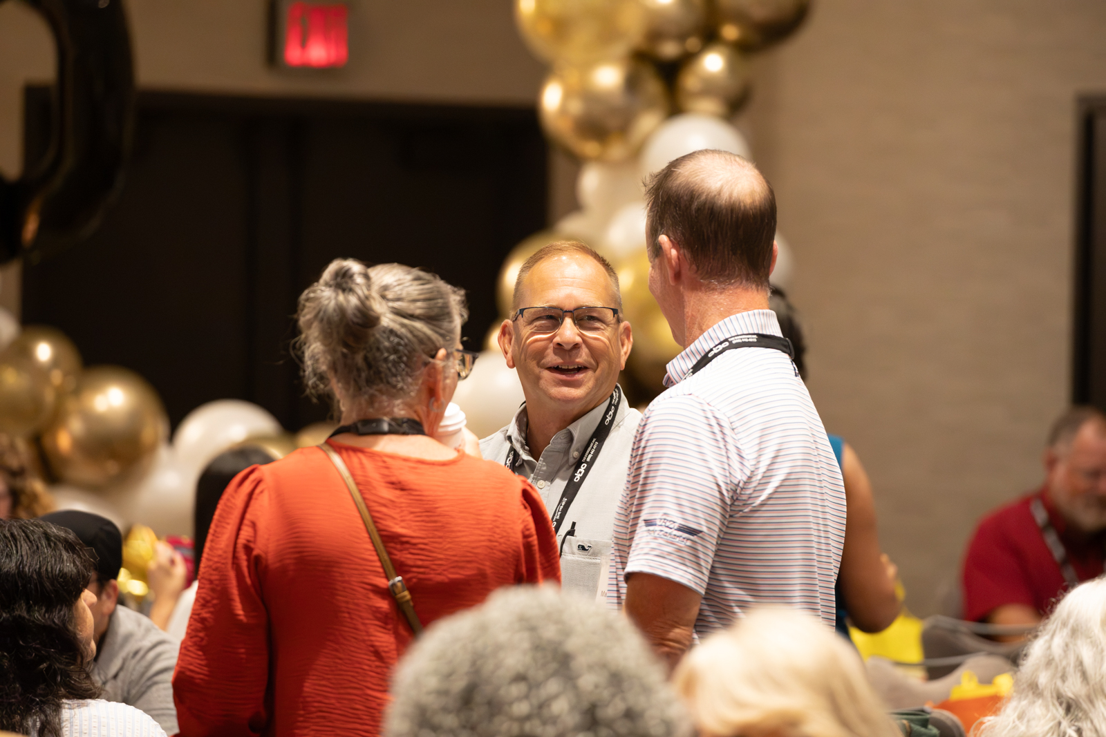 Closing celebration with attendees applauding the keynote speakers
